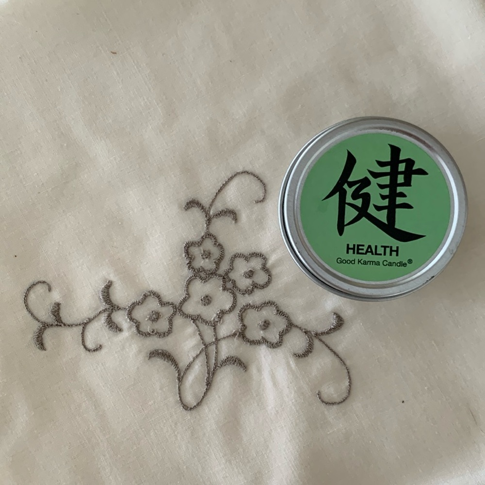 Good Karma Candle Company “Health” travel size candle in a tin